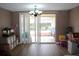 Bright dining room with sliding glass doors leading to a patio at 7204 Westcott Dr, Port Richey, FL 34668