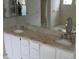 Double vanity bathroom with granite countertop at 18516 Avocet Dr, Lutz, FL 33558