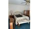 Bedroom with double bed, chest, and bench at 7486 Heather Walk Dr # 31, Weeki Wachee, FL 34613
