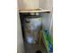 Water heater closet with standard water heater at 7486 Heather Walk Dr # 31, Weeki Wachee, FL 34613