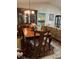 Formal dining room with a wood table and chairs, kitchen view at 7486 Heather Walk Dr # 31, Weeki Wachee, FL 34613