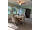 Sunroom with table and chairs, offering scenic water views at 7486 Heather Walk Dr # 31, Weeki Wachee, FL 34613