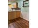 Kitchen boasts light wood cabinets and a tiled backsplash at 7486 Heather Walk Dr # 31, Weeki Wachee, FL 34613