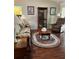 Living room featuring hardwood floors, comfy seating, and a lovely rug at 7486 Heather Walk Dr # 31, Weeki Wachee, FL 34613