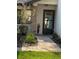 Front entrance with a paved walkway leading to the home's entry door at 7486 Heather Walk Dr # 31, Weeki Wachee, FL 34613
