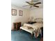 Bedroom with double bed, chest, and bench at 7486 Heather Walk Dr # 31, Weeki Wachee, FL 34613