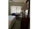 Bedroom with double bed, desk, chair, and ample light at 7486 Heather Walk Dr # 31, Weeki Wachee, FL 34613
