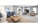 Open-concept kitchen with white cabinets, stainless steel appliances, and an island at 10421 High Noon Trl, Parrish, FL 34219