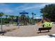 Community playground with swings and play structures at 10421 High Noon Trl, Parrish, FL 34219