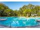 Resort-style pool with plenty of lounge chairs at 10421 High Noon Trl, Parrish, FL 34219