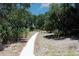 Scenic walking path winding through lush landscaping at 10421 High Noon Trl, Parrish, FL 34219