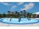 Community waterpark with spray features at 10421 High Noon Trl, Parrish, FL 34219
