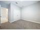 Spacious bedroom with double doors and carpet at 11389 Weaver Hollow Rd, New Port Richey, FL 34654