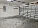 Spacious garage with overhead storage and ample space for two cars at 13069 Maycrest Ave, Weeki Wachee, FL 34614