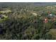 Aerial view of a property surrounded by trees at 13080 Old Crystal River Rd, Brooksville, FL 34601