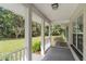 Front porch overlooking a large grassy yard at 13080 Old Crystal River Rd, Brooksville, FL 34601
