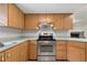Bright kitchen featuring stainless steel appliances and wood cabinets at 13080 Old Crystal River Rd, Brooksville, FL 34601