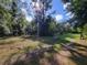Wooded area with a dirt path and wooden fence at 13080 Old Crystal River Rd, Brooksville, FL 34601