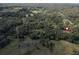 Aerial view of a secluded property in a wooded area at 13080 Old Crystal River Rd, Brooksville, FL 34601