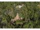Aerial view of a property with a home and outbuildings at 13080 Old Crystal River Rd, Brooksville, FL 34601