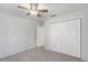 Spacious bedroom with double door closet and ceiling fan at 13080 Old Crystal River Rd, Brooksville, FL 34601