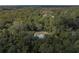 Aerial view of house nestled in a wooded area at 13080 Old Crystal River Rd, Brooksville, FL 34601