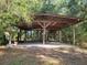 Open-air carport with a concrete floor at 13080 Old Crystal River Rd, Brooksville, FL 34601