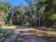 Dirt road leading into a wooded area at 13080 Old Crystal River Rd, Brooksville, FL 34601