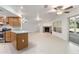 Open living room with tile floors, fireplace and sliding glass doors at 13080 Old Crystal River Rd, Brooksville, FL 34601