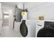 Laundry room with washer, dryer, and extra storage at 13080 Old Crystal River Rd, Brooksville, FL 34601