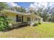 House exterior with front porch and landscaping at 13080 Old Crystal River Rd, Brooksville, FL 34601