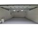 Spacious garage with painted floor and high ceilings at 13080 Old Crystal River Rd, Brooksville, FL 34601