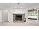 Stone fireplace with built-in shelving and hearth at 13080 Old Crystal River Rd, Brooksville, FL 34601