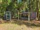 Chicken coop and run in a wooded area at 13080 Old Crystal River Rd, Brooksville, FL 34601