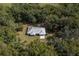 House nestled in a lush wooded area, offering privacy at 13080 Old Crystal River Rd, Brooksville, FL 34601