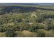 Aerial view showcasing a home nestled in a wooded area at 13080 Old Crystal River Rd, Brooksville, FL 34601