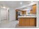 Open concept kitchen with island and stainless steel refrigerator at 13080 Old Crystal River Rd, Brooksville, FL 34601