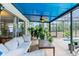 Relaxing screened patio with comfy seating at 13242 Little Farms Dr, Spring Hill, FL 34609