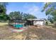 Large backyard with a screened pool and patio at 13242 Little Farms Dr, Spring Hill, FL 34609