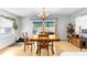 Bright dining area with wooden table and access to the pool at 13242 Little Farms Dr, Spring Hill, FL 34609
