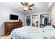 Bedroom with double closets, ceiling fan, and a view to another room at 13242 Little Farms Dr, Spring Hill, FL 34609