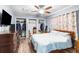 Main bedroom with double closets, ceiling fan, and plenty of space for furniture at 13242 Little Farms Dr, Spring Hill, FL 34609