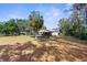 Large backyard with a screened pool at 13242 Little Farms Dr, Spring Hill, FL 34609