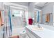 Updated bathroom with a tub/shower, vanity, and updated fixtures at 13242 Little Farms Dr, Spring Hill, FL 34609