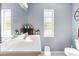 Clean bathroom with single vanity, large mirror, and a bathtub shower combo at 13242 Little Farms Dr, Spring Hill, FL 34609