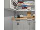 Well-organized laundry room with wood countertop and ample storage at 14485 Switch Back Rd, Brooksville, FL 34609