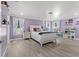 Spacious purple bedroom with large bed and plenty of storage at 14485 Switch Back Rd, Brooksville, FL 34609