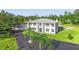 Expansive property featuring a stately home, lush greenery, and a circular driveway at 14485 Switch Back Rd, Brooksville, FL 34609