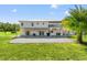 Two-story home with large covered patio and expansive lawn at 14485 Switch Back Rd, Brooksville, FL 34609