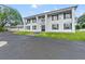 Elegant home boasts a grand entrance, manicured lawn, and ample parking with a three-car garage at 14485 Switch Back Rd, Brooksville, FL 34609